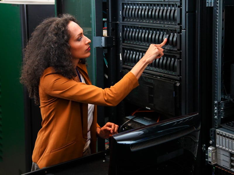 Woman checking server rack size